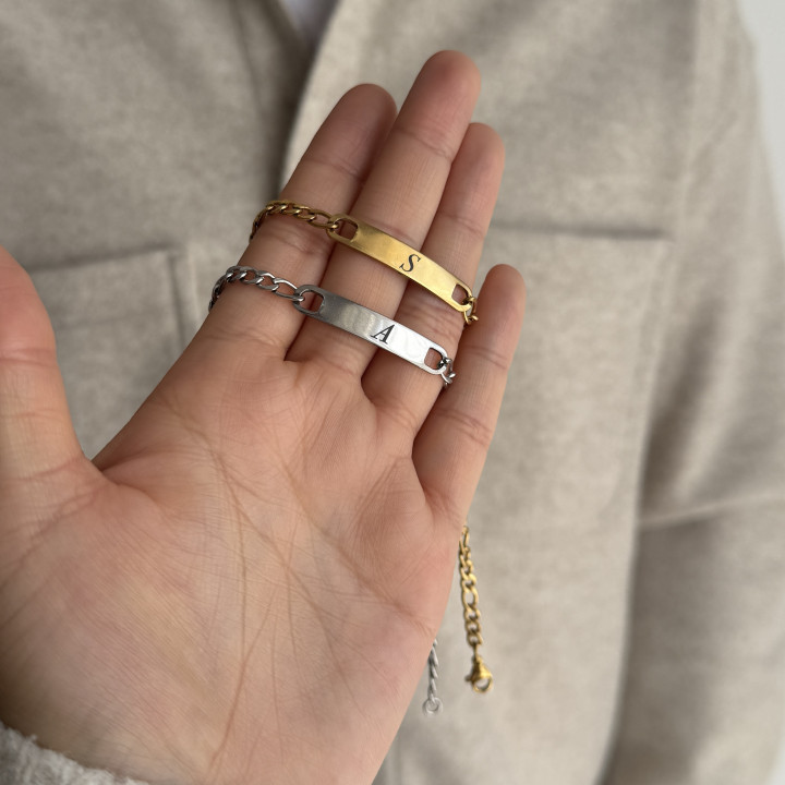 Dúo de esclavas con inicial